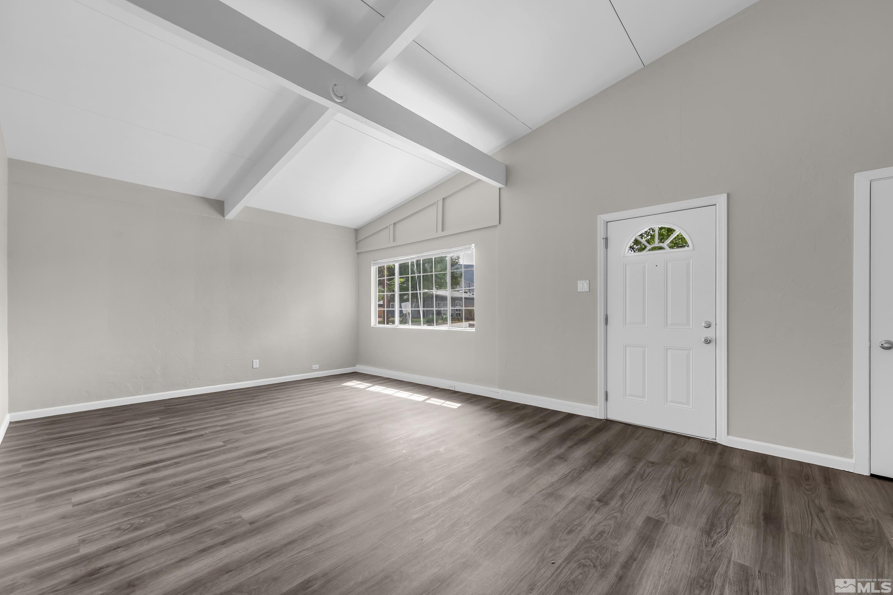 12000 Rocky Mountain Street Reno, NV 89506 - Photo 8 of 40 an empty room with wooden floor and windows