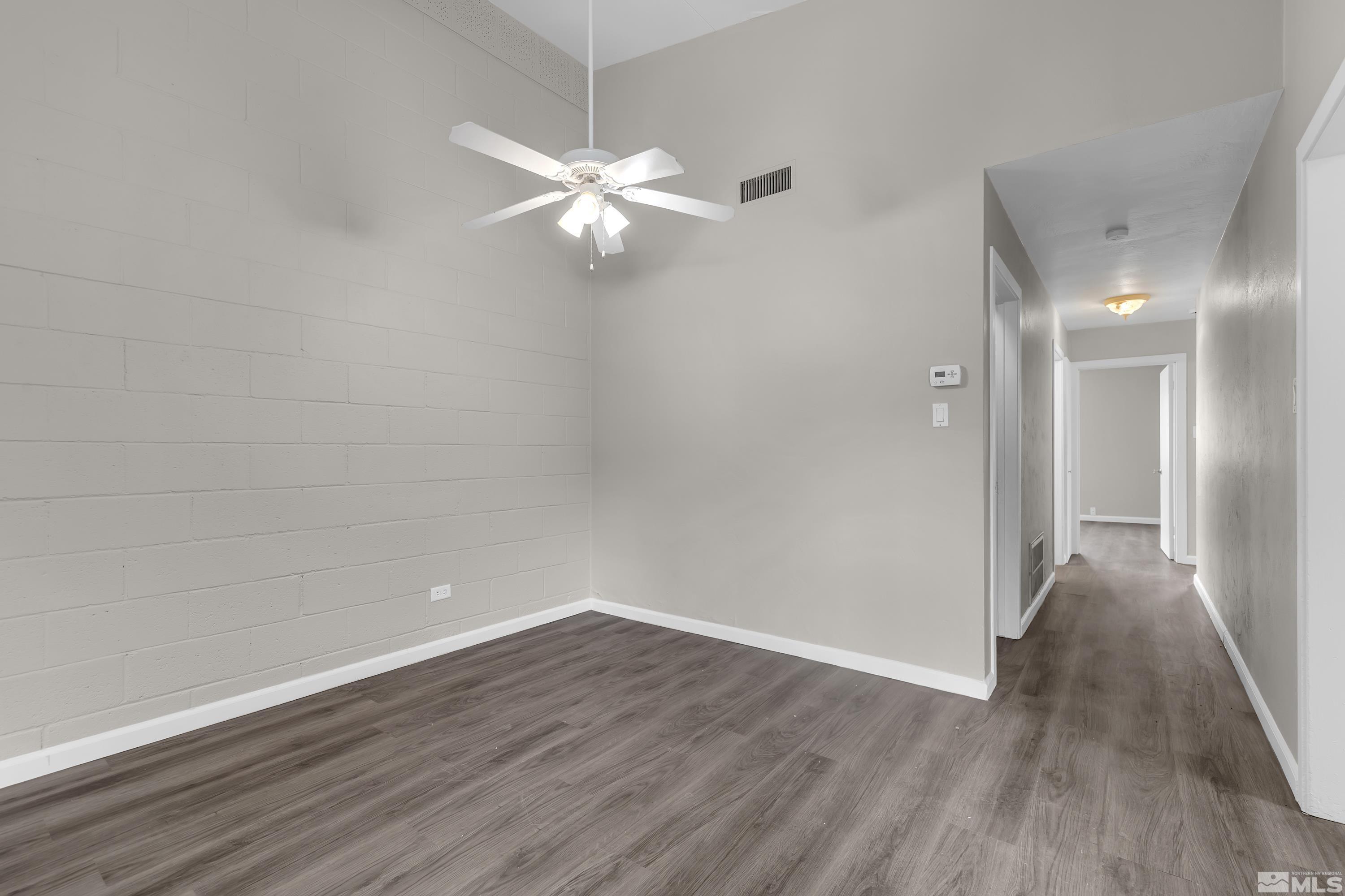 12000 Rocky Mountain Street Reno, NV 89506 - Photo 9 of 40 a view of an empty room with wooden floor