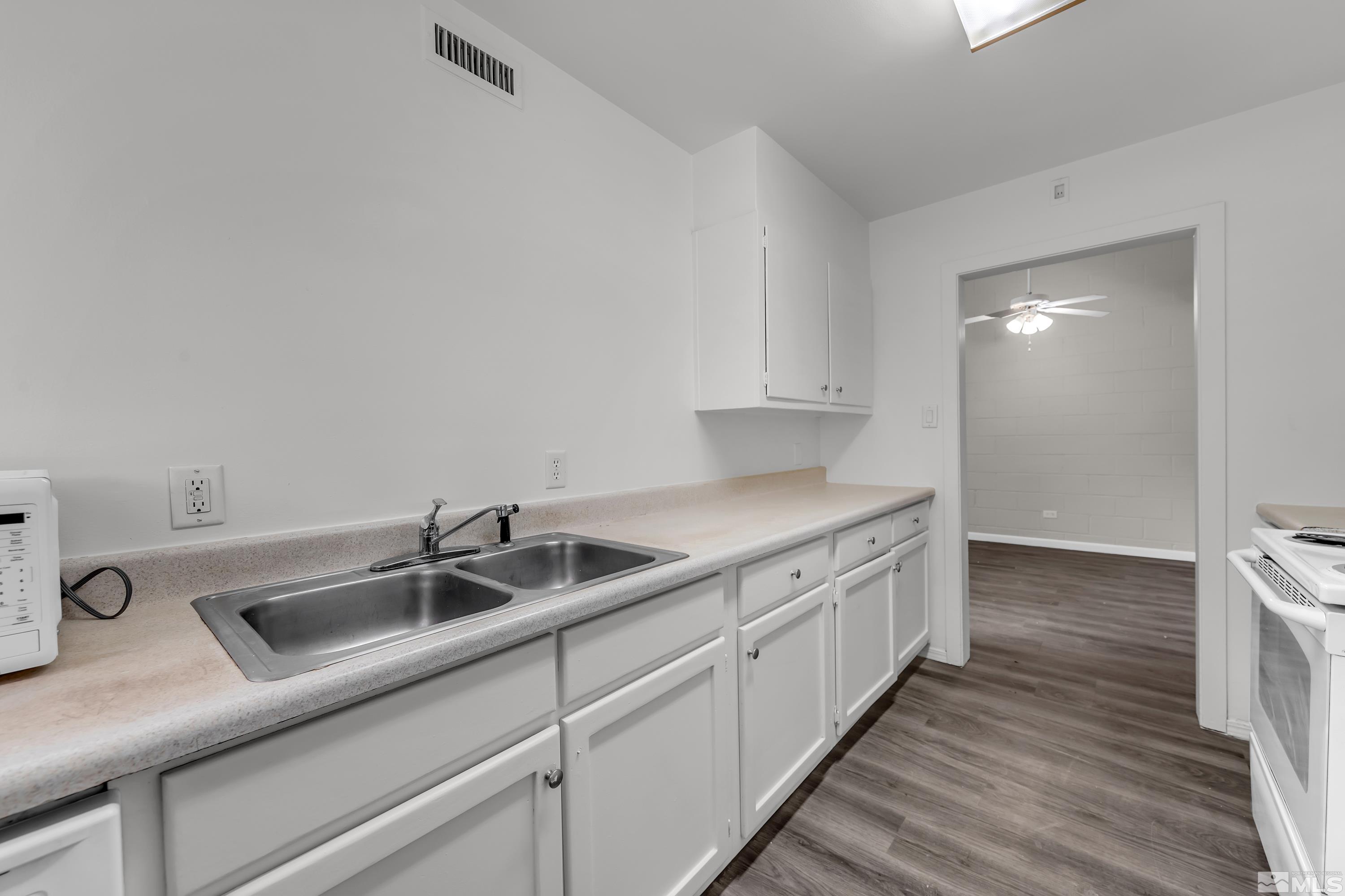 12000 Rocky Mountain Street Reno, NV 89506 - Photo 10 of 40 a kitchen with a sink and cabinets
