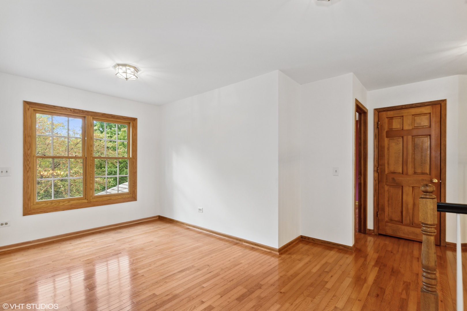 430 Long Hill Road Gurnee, IL 60031 - Photo 13 of 27 an empty room with wooden floor and windows