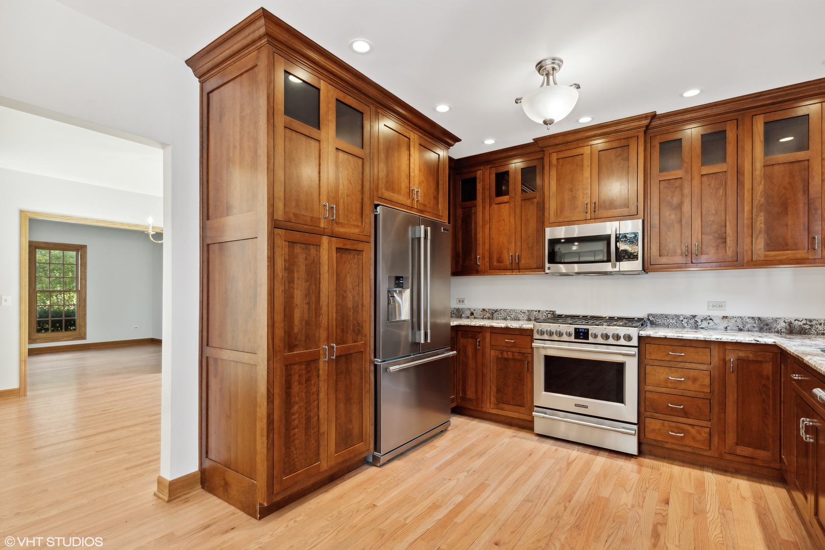 430 Long Hill Road Gurnee, IL 60031 - Photo 5 of 27 a kitchen with stainless steel appliances granite countertop a refrigerator a stove and a sink