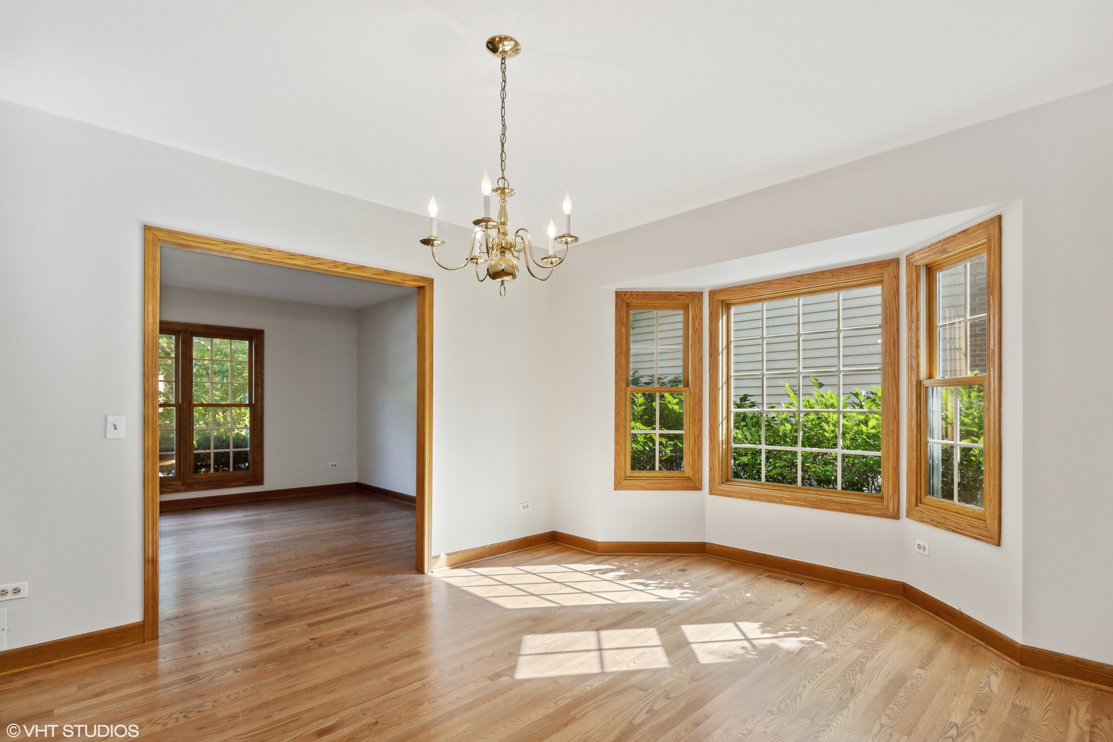 430 Long Hill Road Gurnee, IL 60031 - Photo 6 of 27 a view of an empty room with window and wooden floor