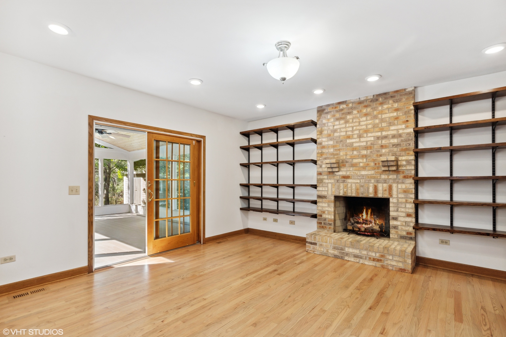 430 Long Hill Road Gurnee, IL 60031 - Photo 9 of 27 a view of an empty room with a fireplace and a window