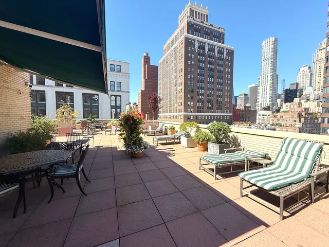 a view of a chairs and table on the terrace