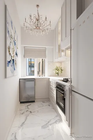 a kitchen with refrigerator and window