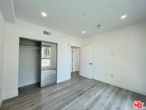 a view of a livingroom with wooden floor