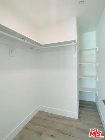 a view of an empty walk in closet