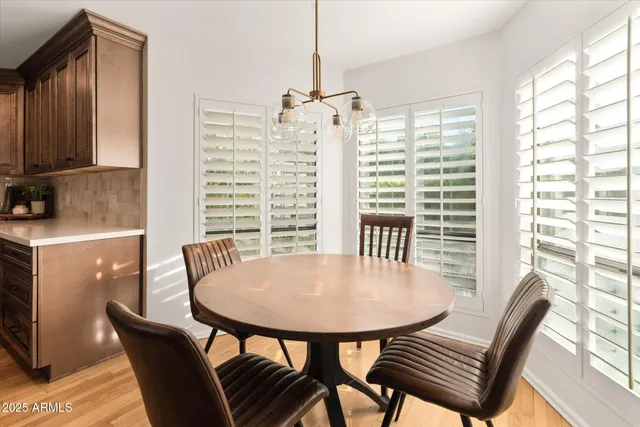 a view of a living room and chandelier with furniture