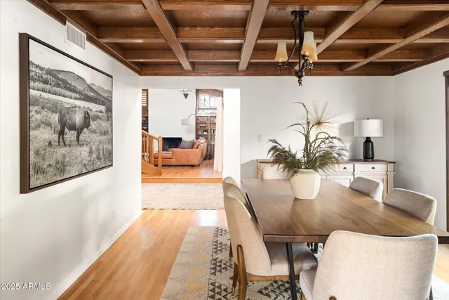 a living room with furniture and book shelf