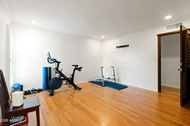 a bathroom with a bathtub a mirror a sink and vanity