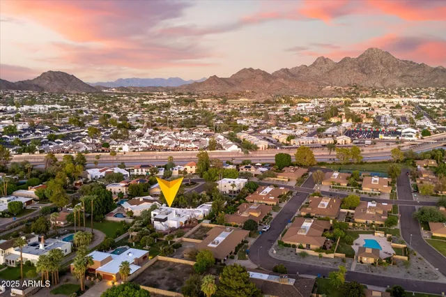 a view of a house with backyard porch and sitting area