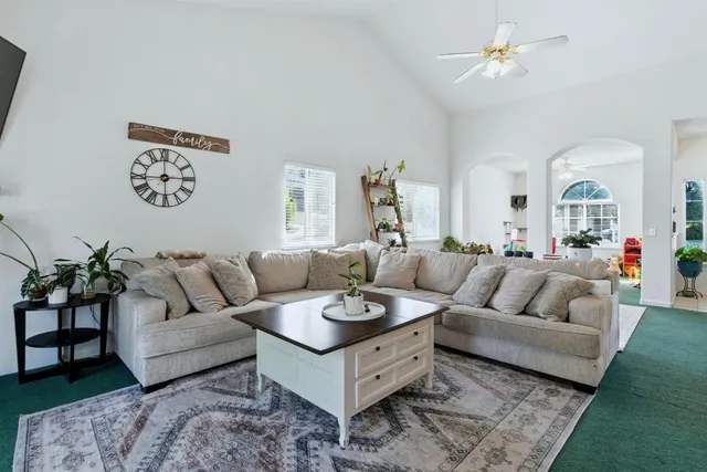 a living room with furniture and a table