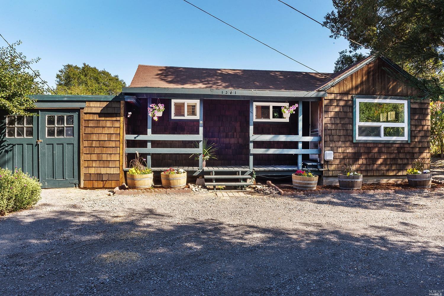 1301 Bloomfield Road Sebastopol, CA 95472 - Photo 1 of 1 a front view of a house with a yard