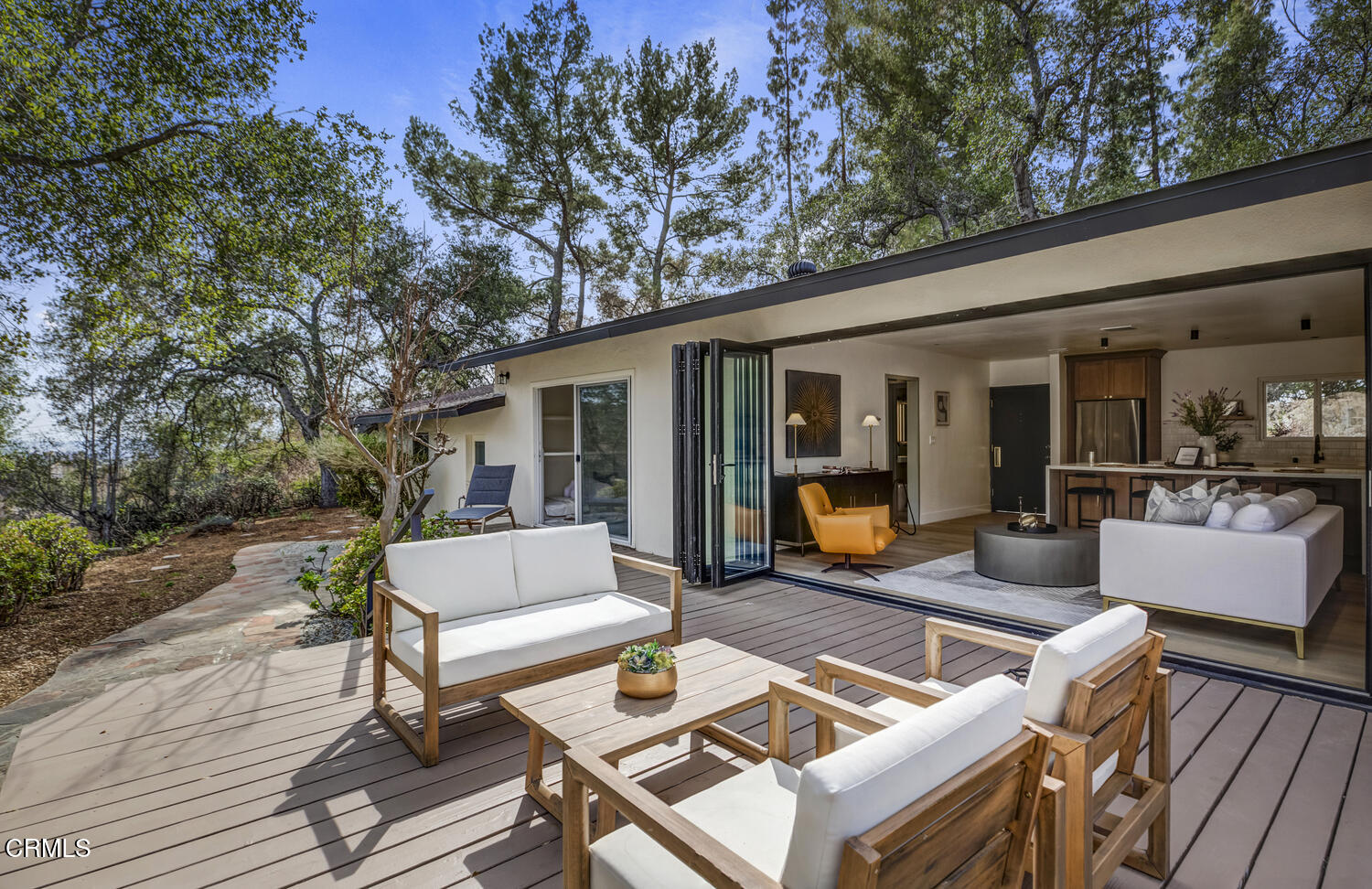 1780 North Altadena Drive Pasadena, CA 91107 - Photo 27 of 34 a view of a patio with couches table and chairs with wooden floor and fence and a trees
