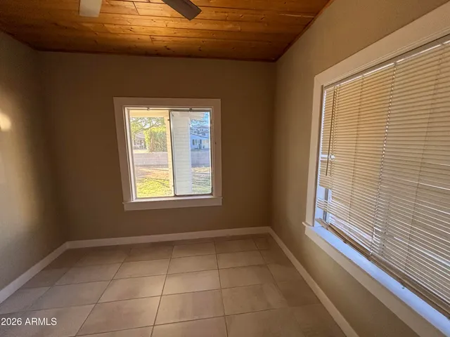a view of a hallway with a wooden door
