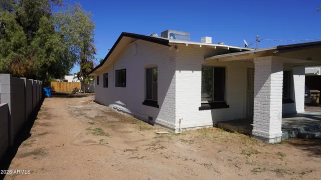 a view of hallway with windows and wooden floor