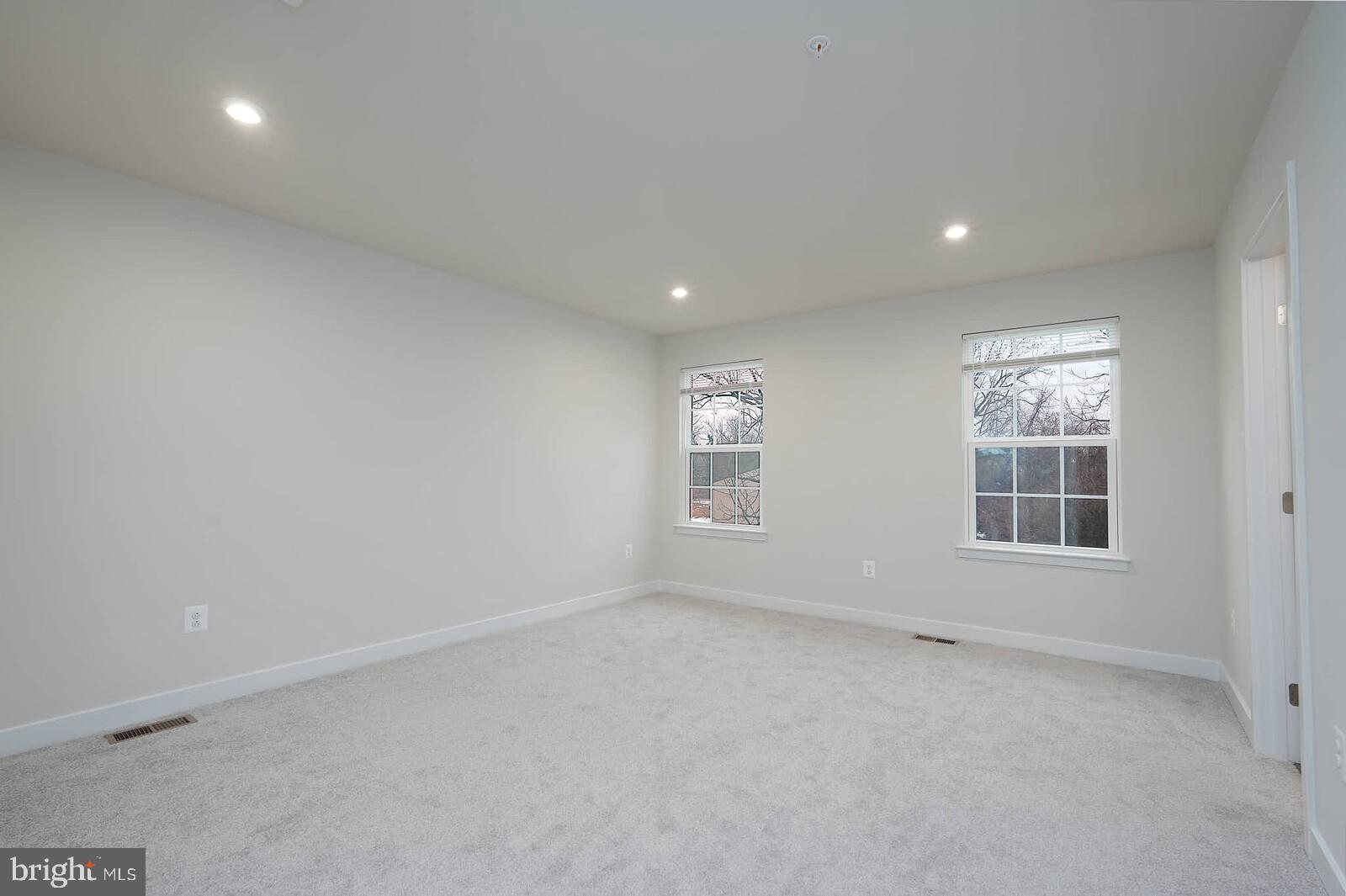 336 Paca Gardens Lane Frederick, MD 21703 - Photo 21 of 36 an empty room with windows