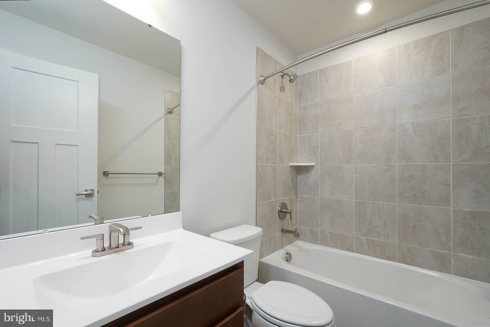 336 Paca Gardens Lane Frederick, MD 21703 - Photo 27 of 36 a bathroom with a sink toilet and shower