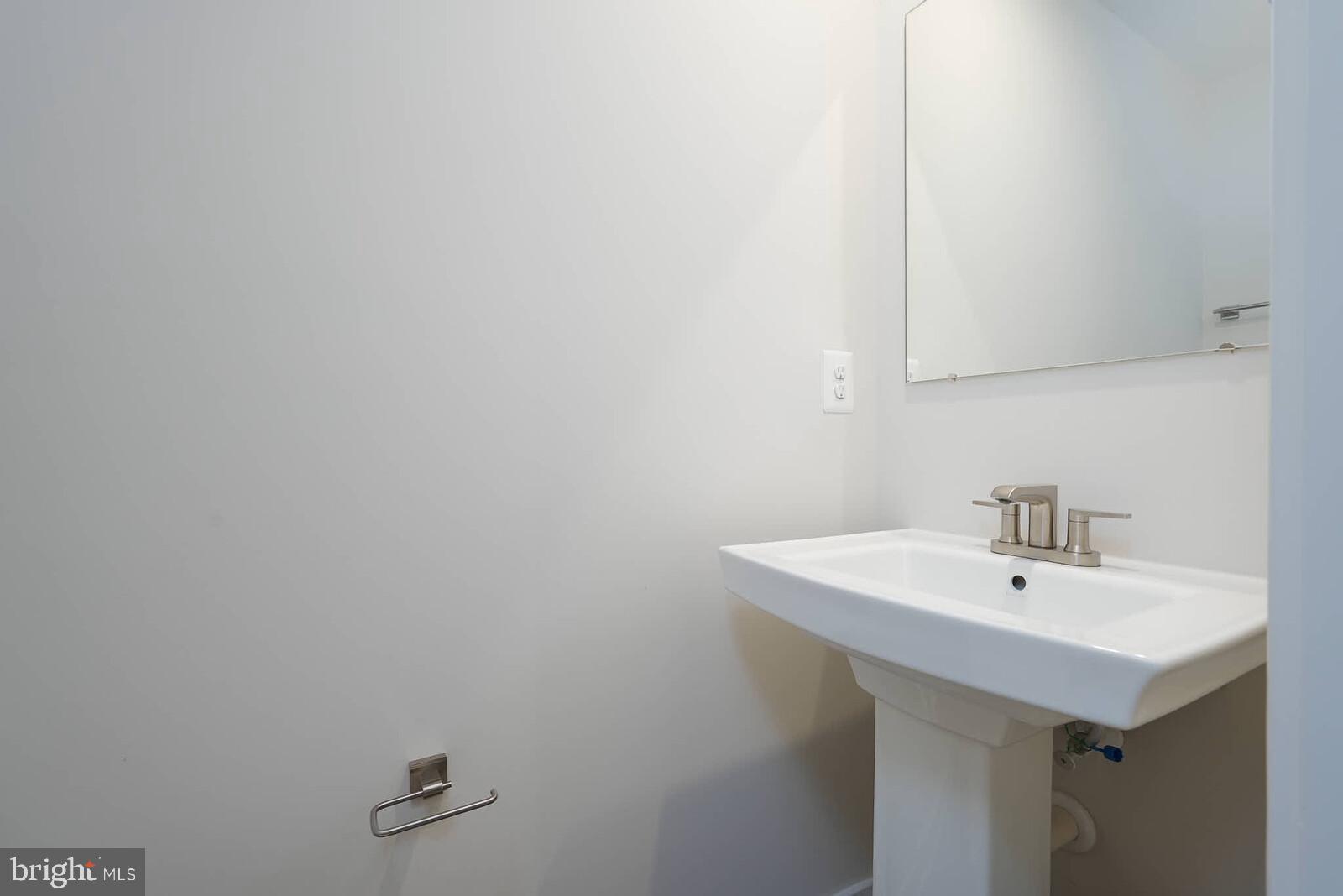 336 Paca Gardens Lane Frederick, MD 21703 - Photo 35 of 36 a bathroom with a sink and mirror