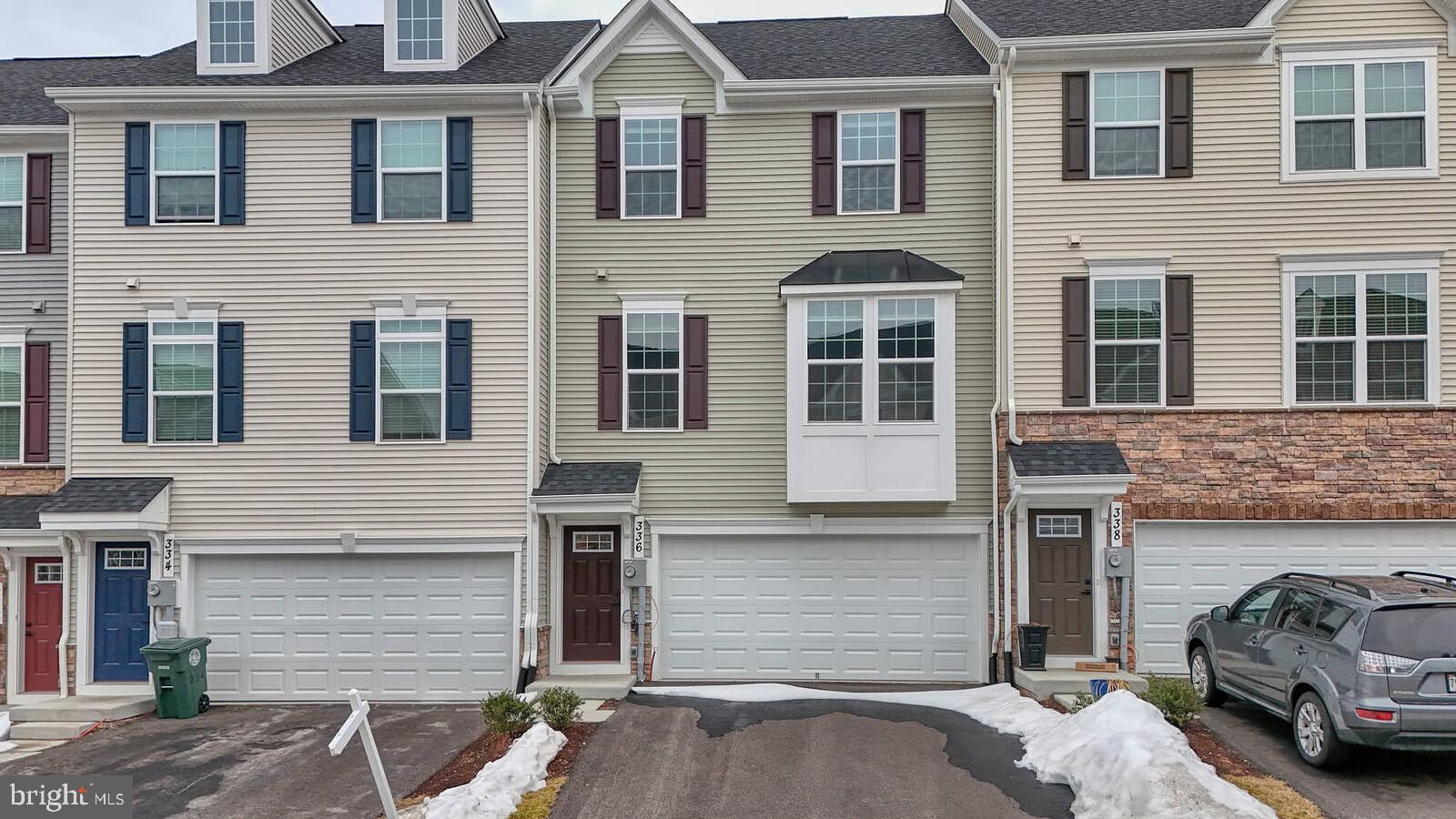 336 Paca Gardens Lane Frederick, MD 21703 - Photo 4 of 36 a front view of a house with parking space