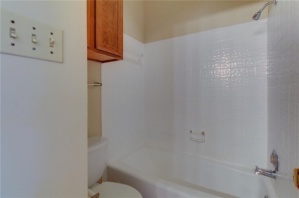 2802 Nueces Street, Unit 206 Austin, TX 78705 - Photo 11 of 14 a bathroom with a shower and a toilet