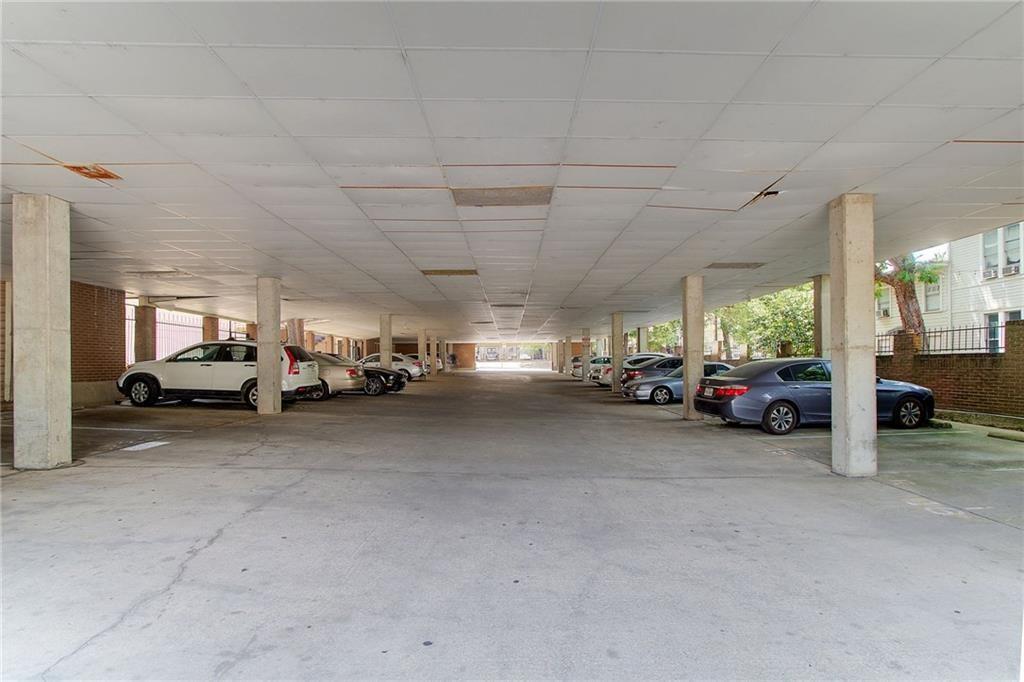 2802 Nueces Street, Unit 206 Austin, TX 78705 - Photo 14 of 14 a view of parking space with lots of cars parked