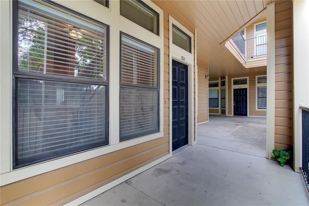 2802 Nueces Street, Unit 206 Austin, TX 78705 - Photo 3 of 14 a view of a brick house with a large windows