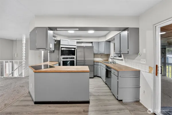 a kitchen with a sink and cabinets