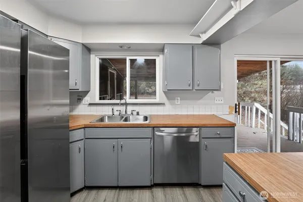 a view of an empty room with glass door