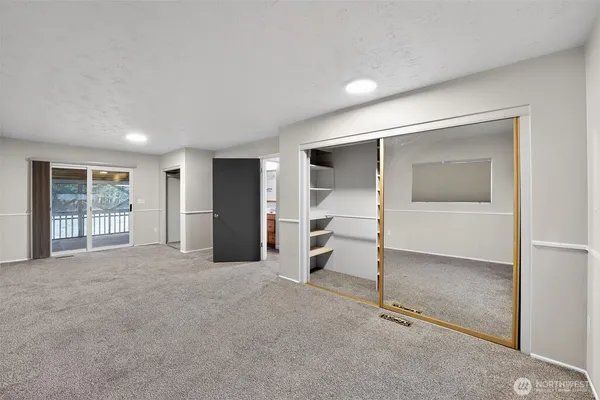 a view of an empty room with a window