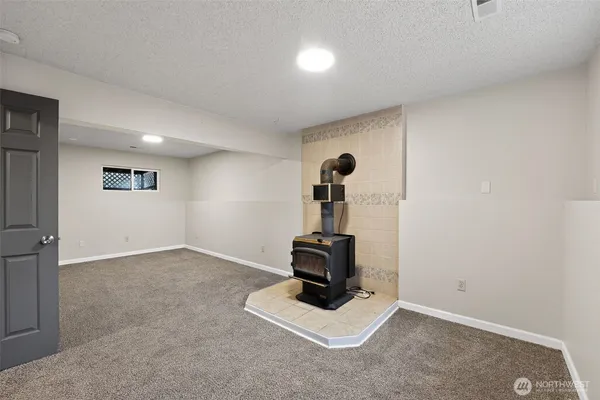 a bathroom with a sink toilet a mirror and shower