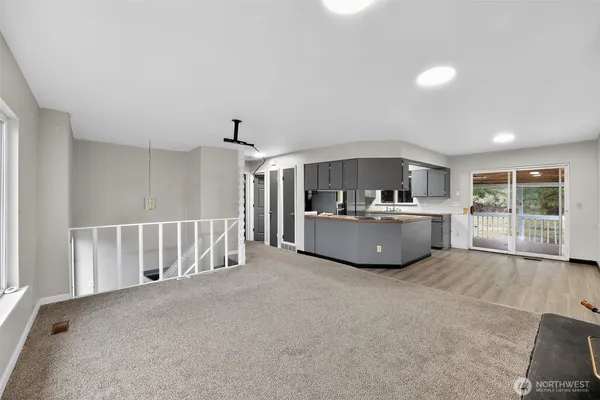 a view of a kitchen with a sink and a bathtub