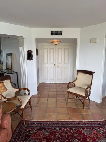 a bedroom with a bed and chair