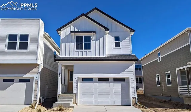 a front view of a house with a garage