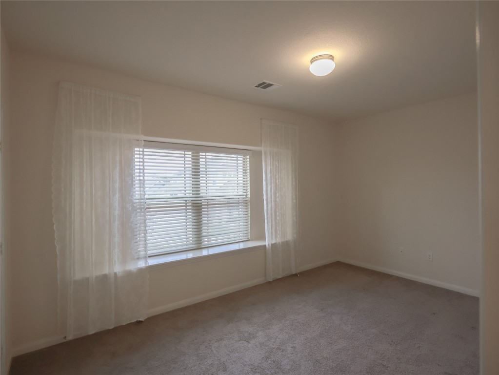 14008 Madrigal Lane Austin, TX 78660 - Photo 13 of 18 an empty room with a window