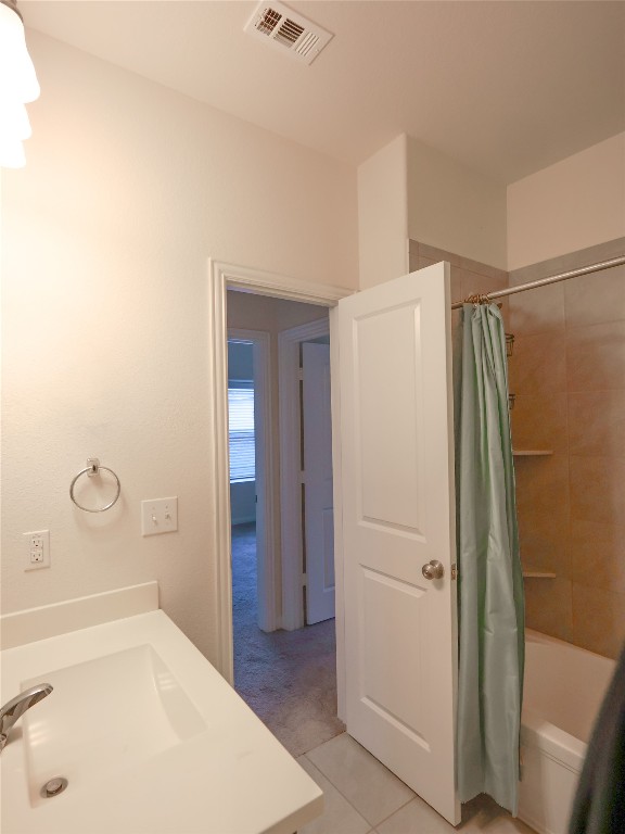 14008 Madrigal Lane Austin, TX 78660 - Photo 16 of 18 a bathroom with a bathtub and a shower