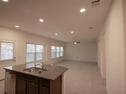 a bathroom with sink granite and mirror