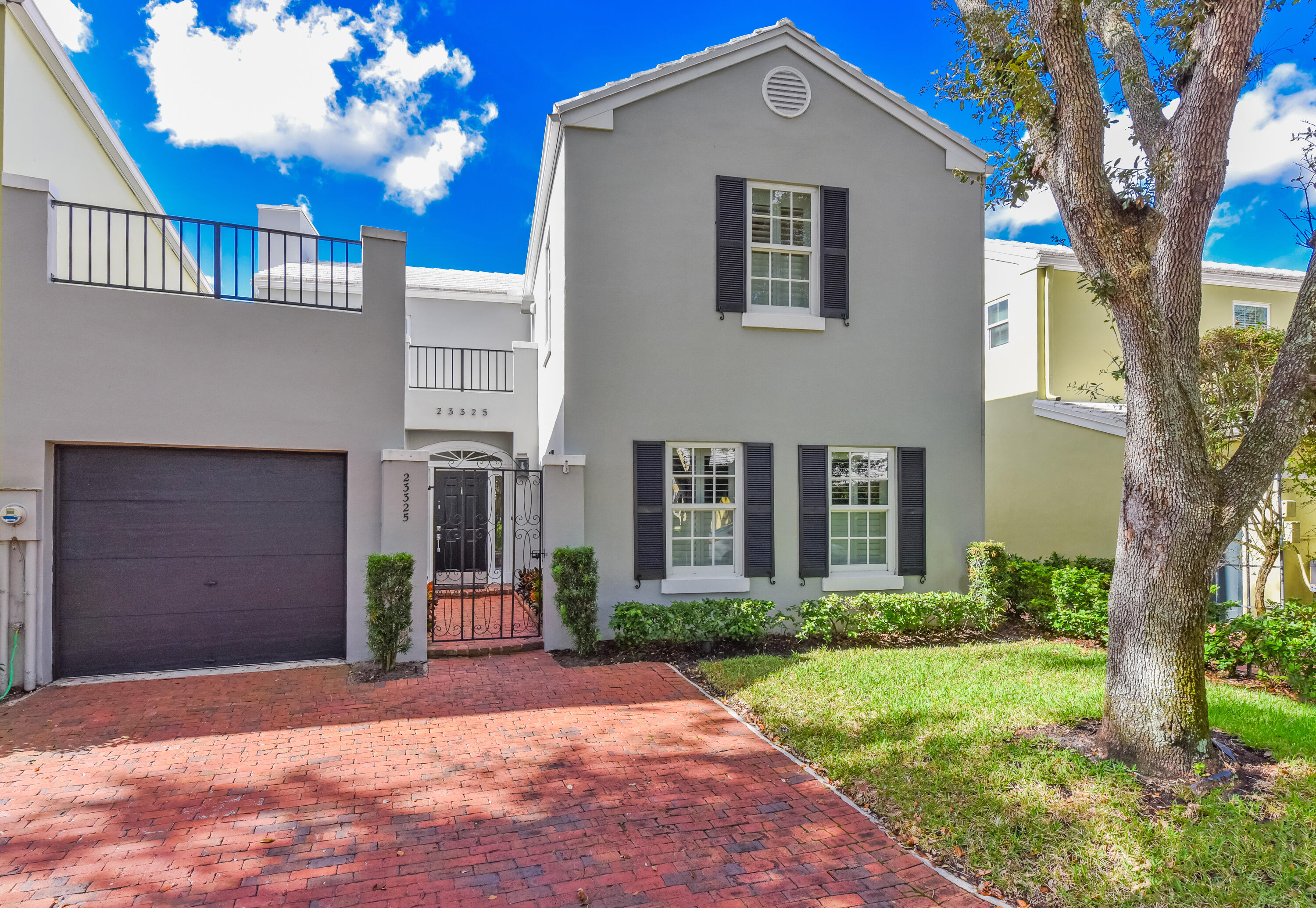 23325 Drayton Drive Boca Raton, FL 33433 - Photo 1 of 44 a front view of a house with garden