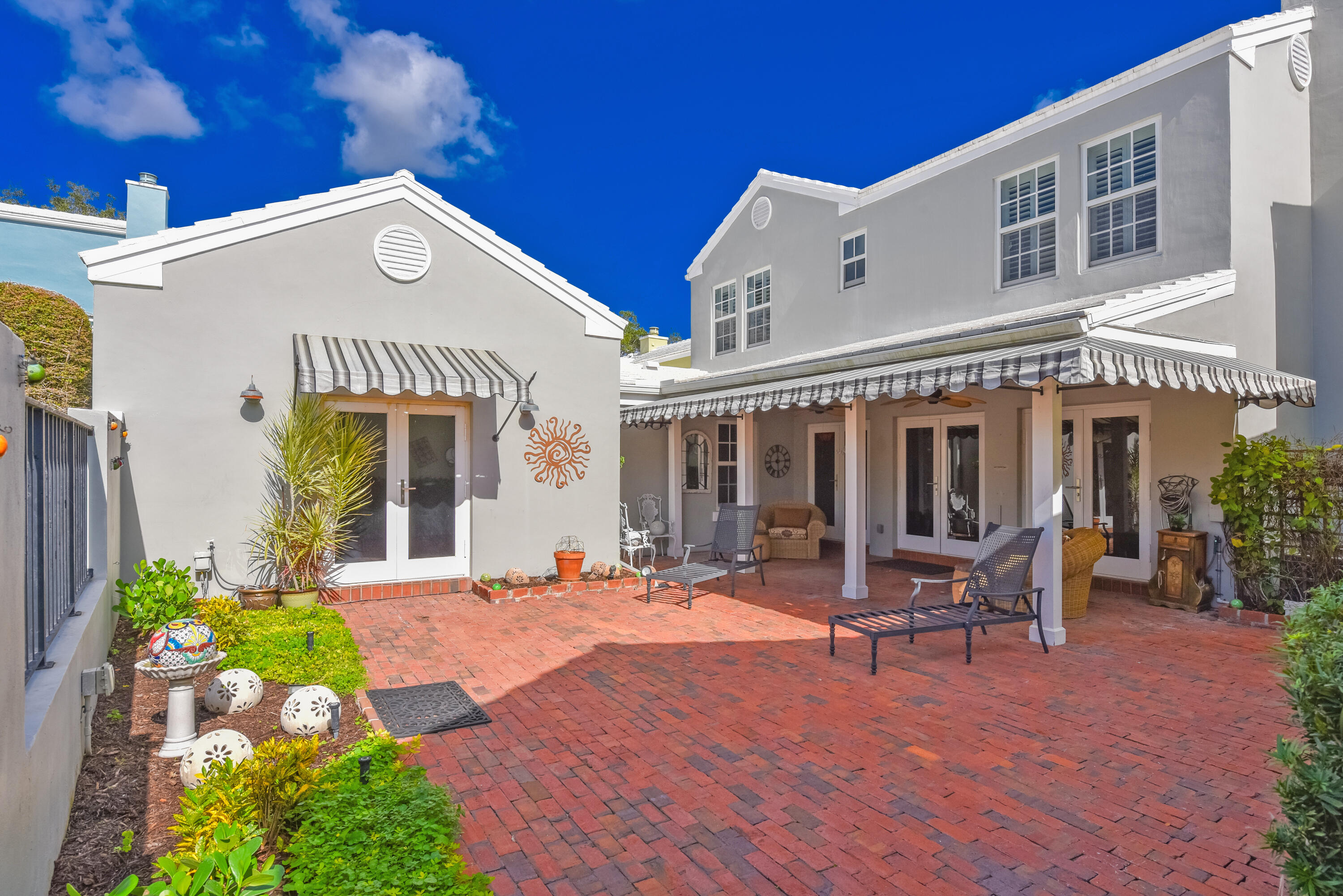 23325 Drayton Drive Boca Raton, FL 33433 - Photo 13 of 44 a view of a house with sitting area and garden