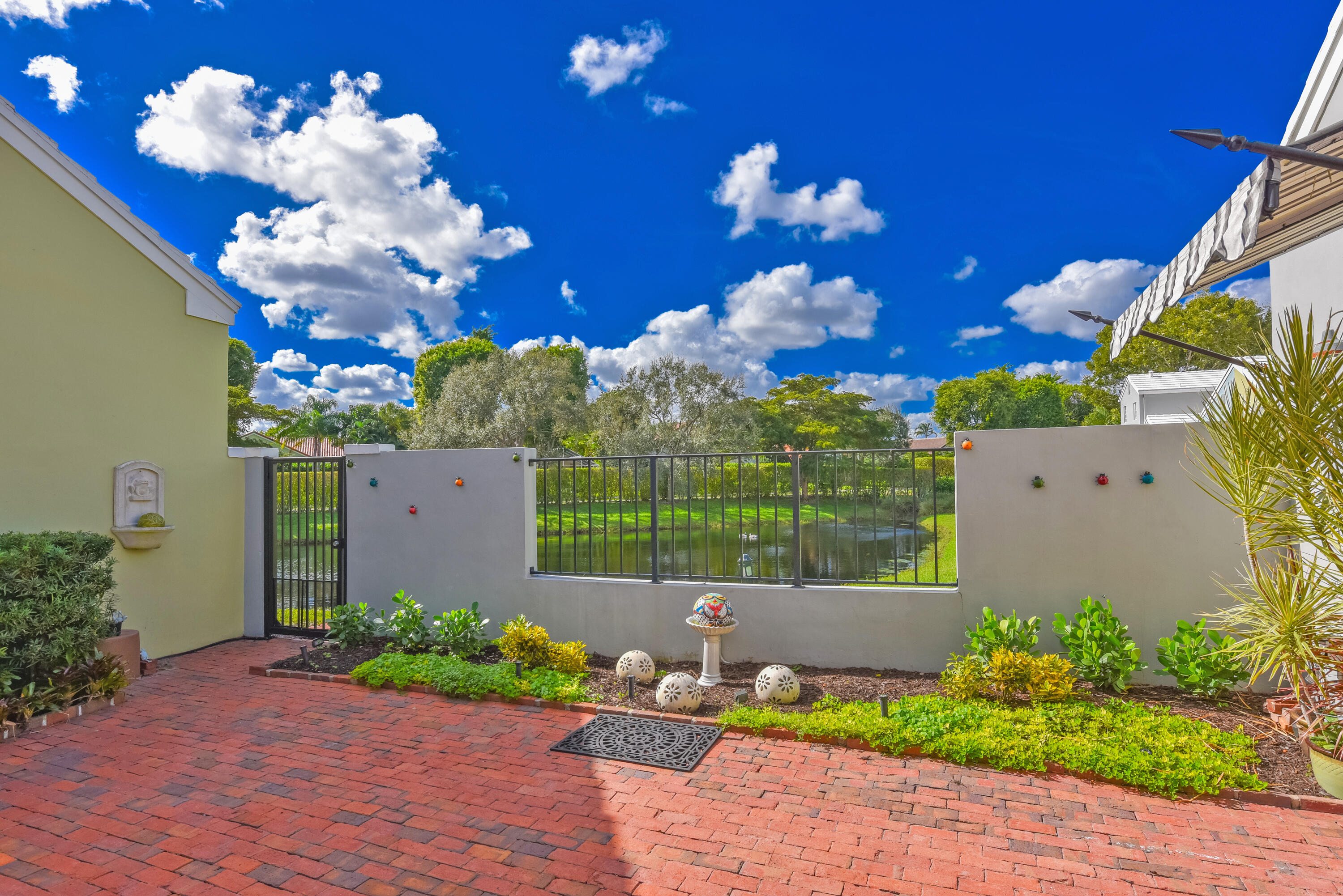 23325 Drayton Drive Boca Raton, FL 33433 - Photo 18 of 44 a vase of flowers sitting on a wooden floor