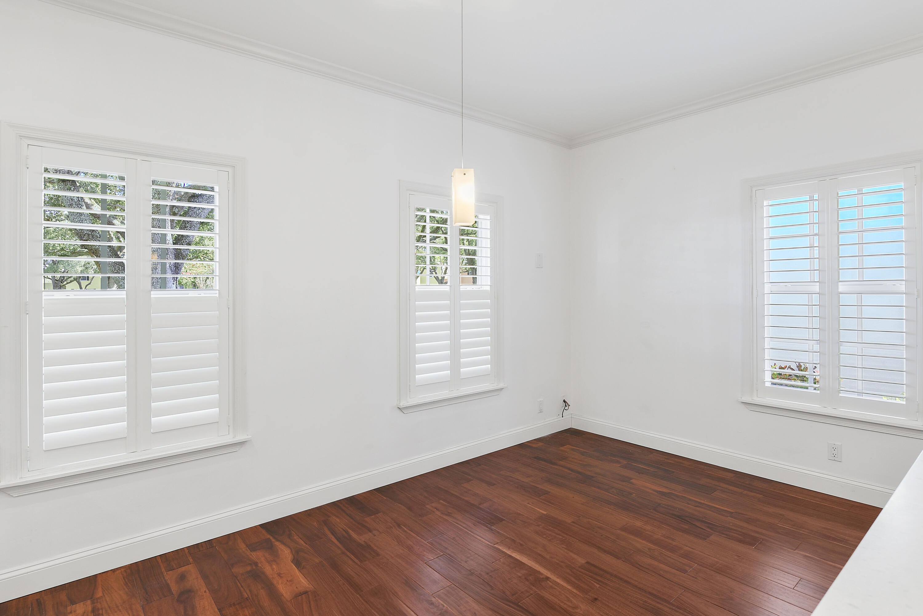23325 Drayton Drive Boca Raton, FL 33433 - Photo 24 of 44 an empty room with wooden floor and windows