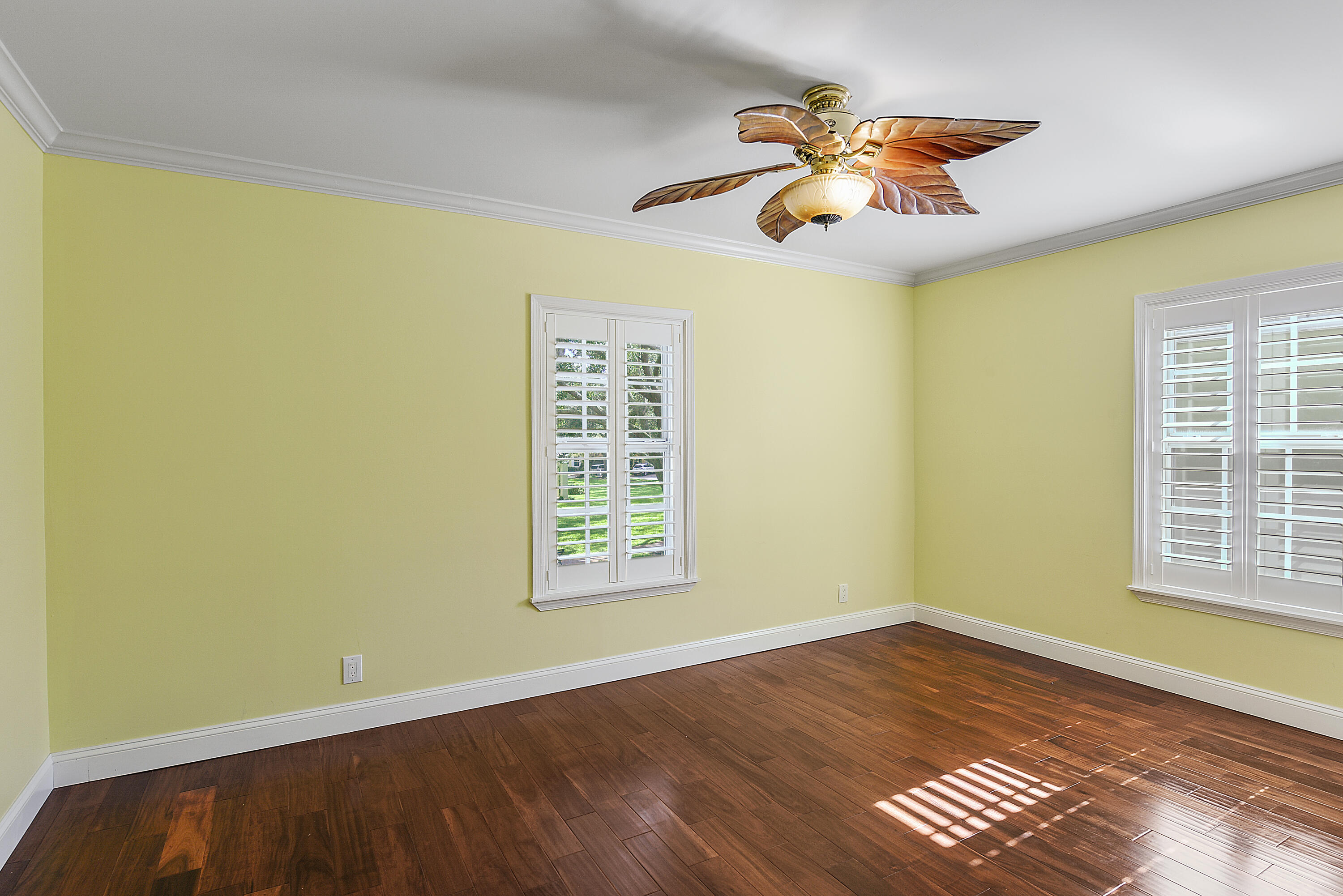 23325 Drayton Drive Boca Raton, FL 33433 - Photo 27 of 44 a view of an empty room with wooden floor and a window