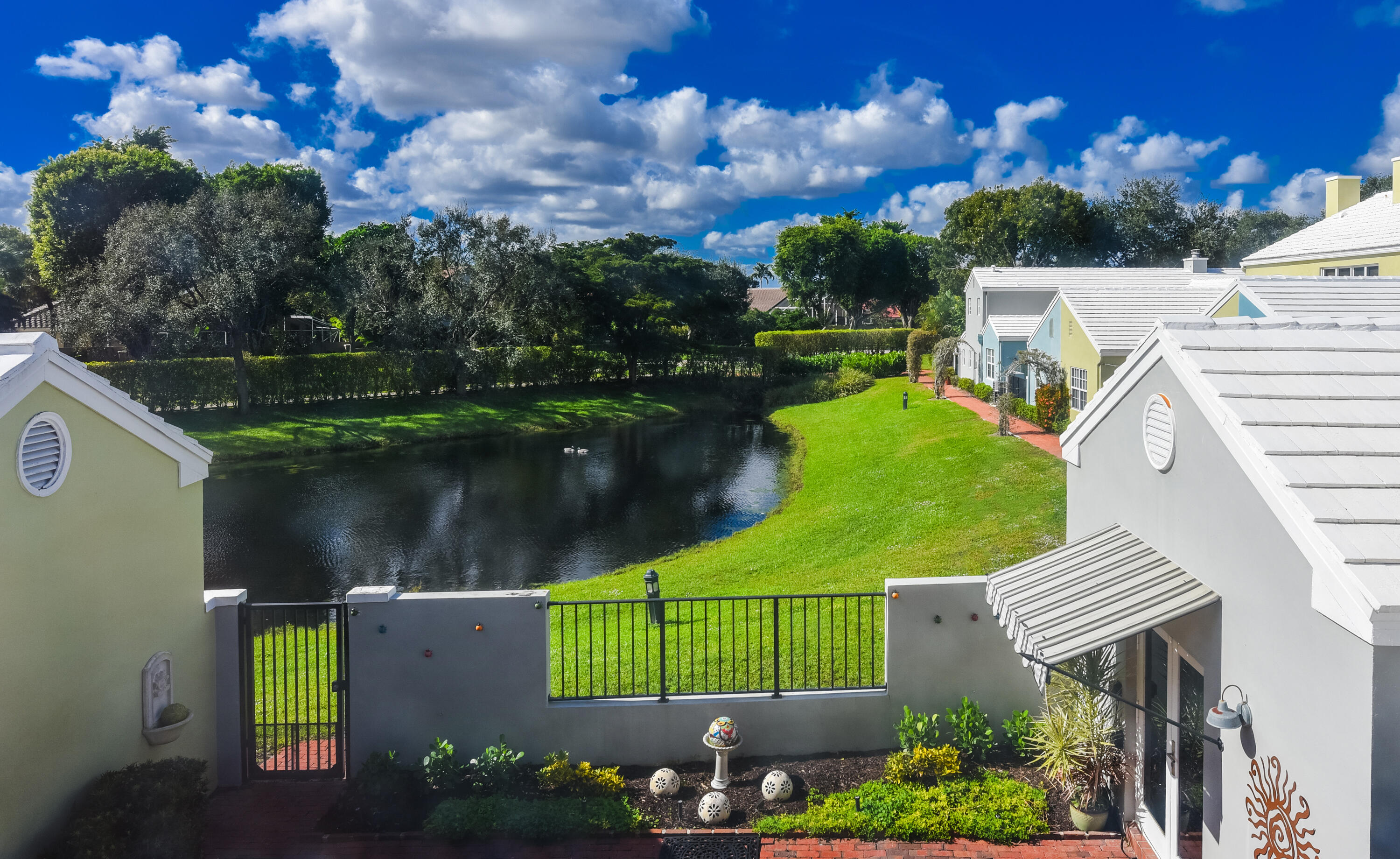 23325 Drayton Drive Boca Raton, FL 33433 - Photo 30 of 44 a view of a house with a yard and a pool