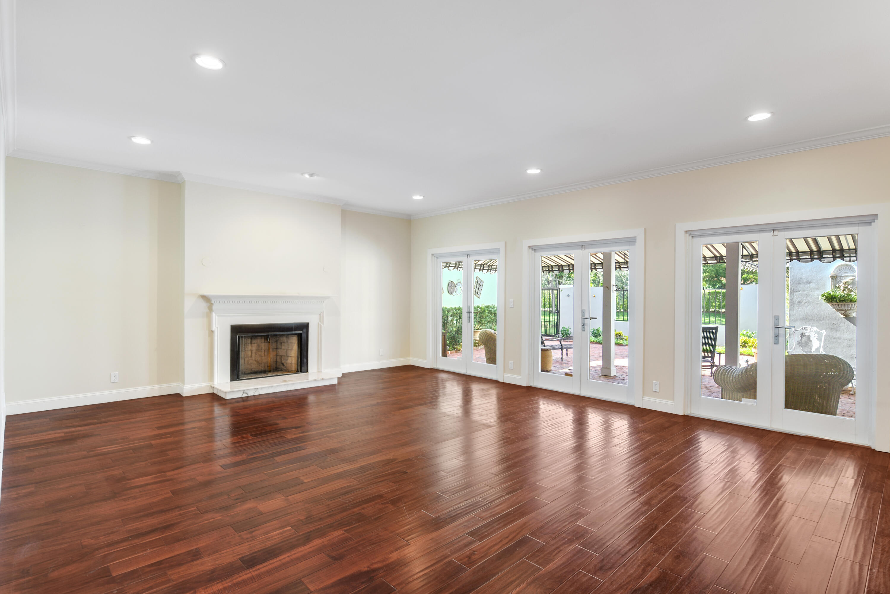 23325 Drayton Drive Boca Raton, FL 33433 - Photo 4 of 44 a view of an empty room with wooden floor and a window