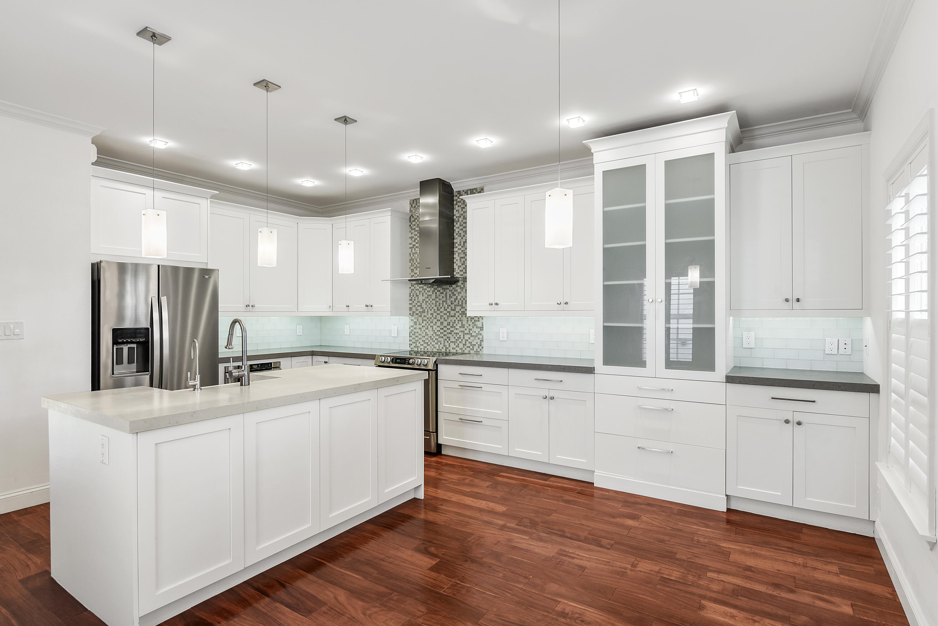 23325 Drayton Drive Boca Raton, FL 33433 - Photo 9 of 44 a kitchen with stainless steel appliances granite countertop a sink stove and refrigerator