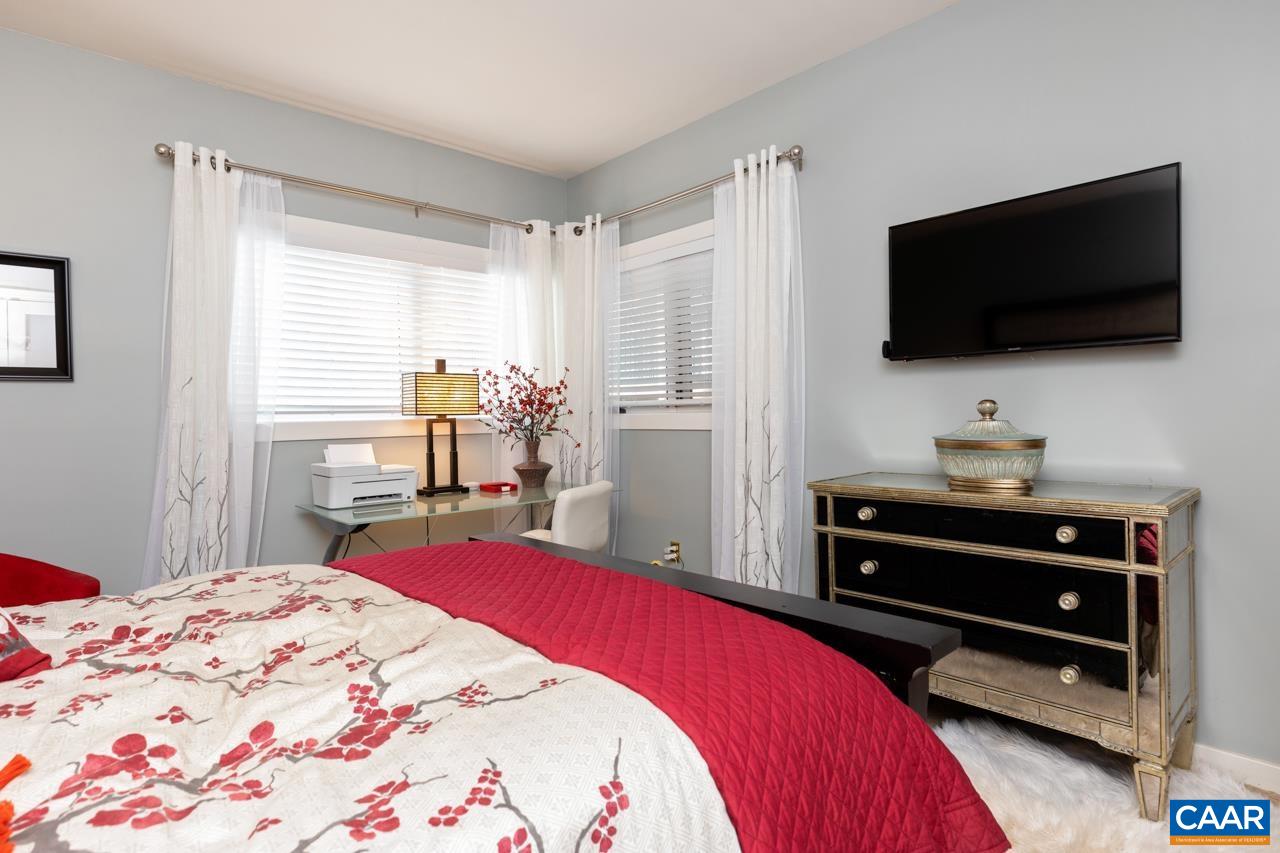 1707 High Ridge Wintergreen, VA 22967 - Photo 25 of 50 a bedroom with a bed and a flat screen tv