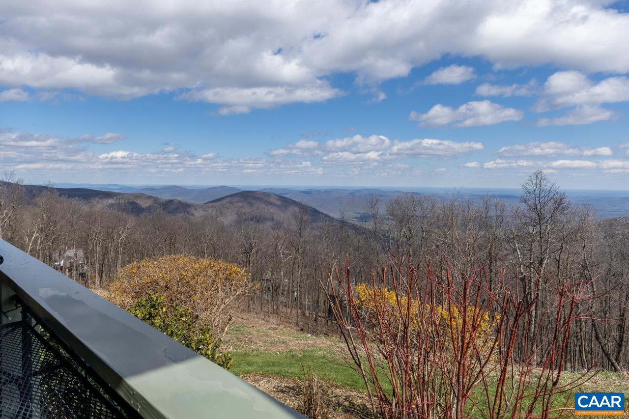 1707 High Ridge Wintergreen, VA 22967 - Photo 39 of 50 a view of a lake with a city in the background