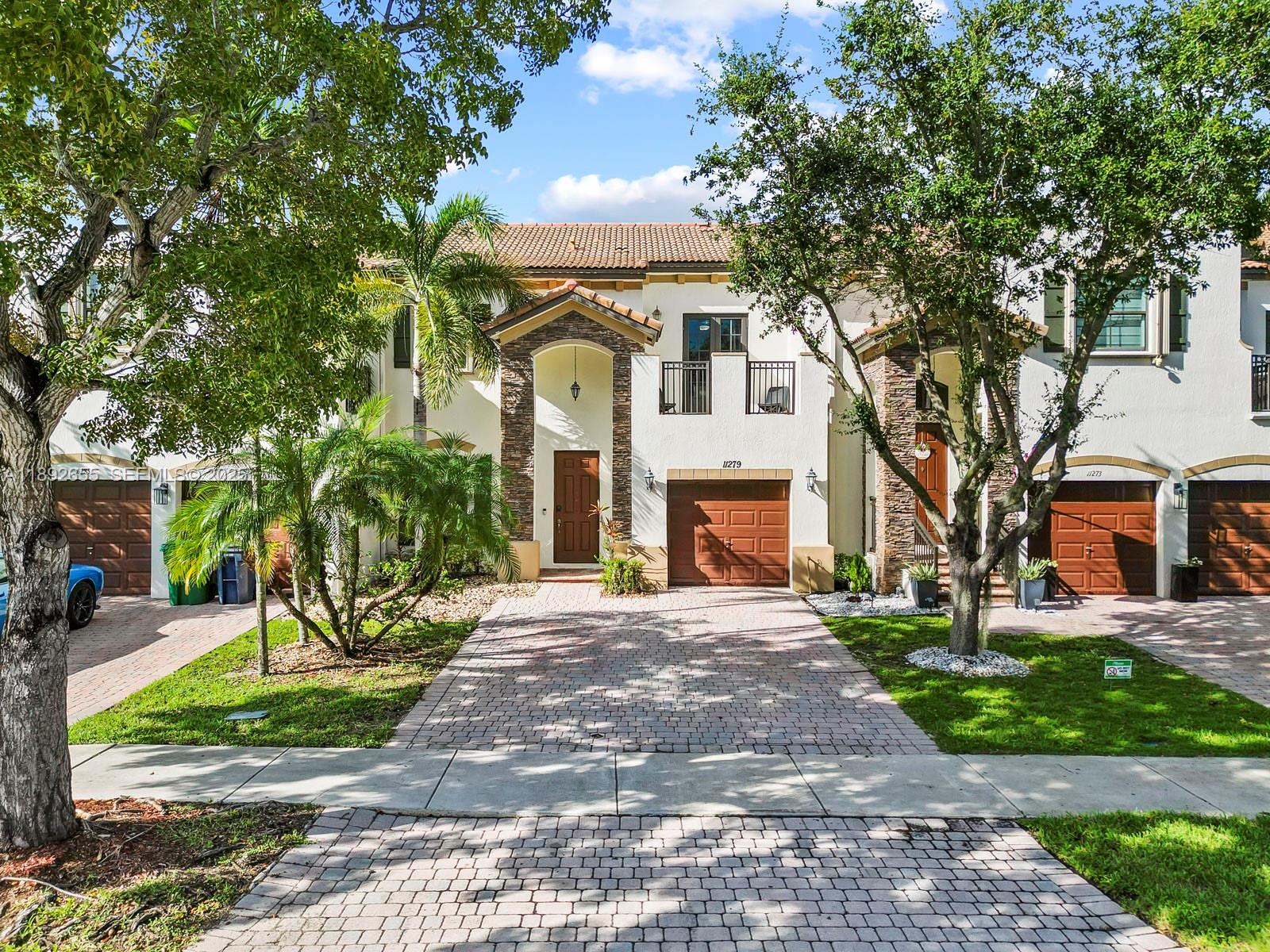 11279 Southwest 238th Street Homestead, FL 33032 - Photo 1 of 40 a front view of a house with a yard
