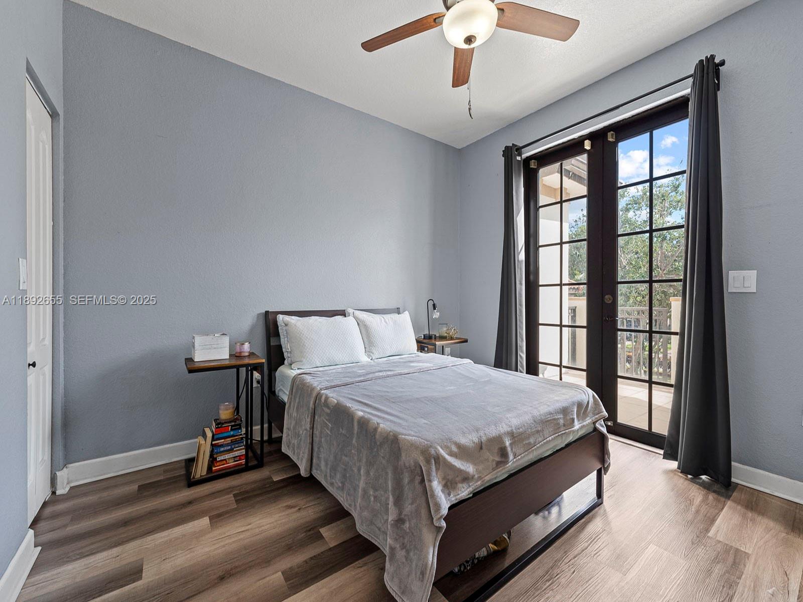11279 Southwest 238th Street Homestead, FL 33032 - Photo 16 of 40 a bedroom with a bed and a large window