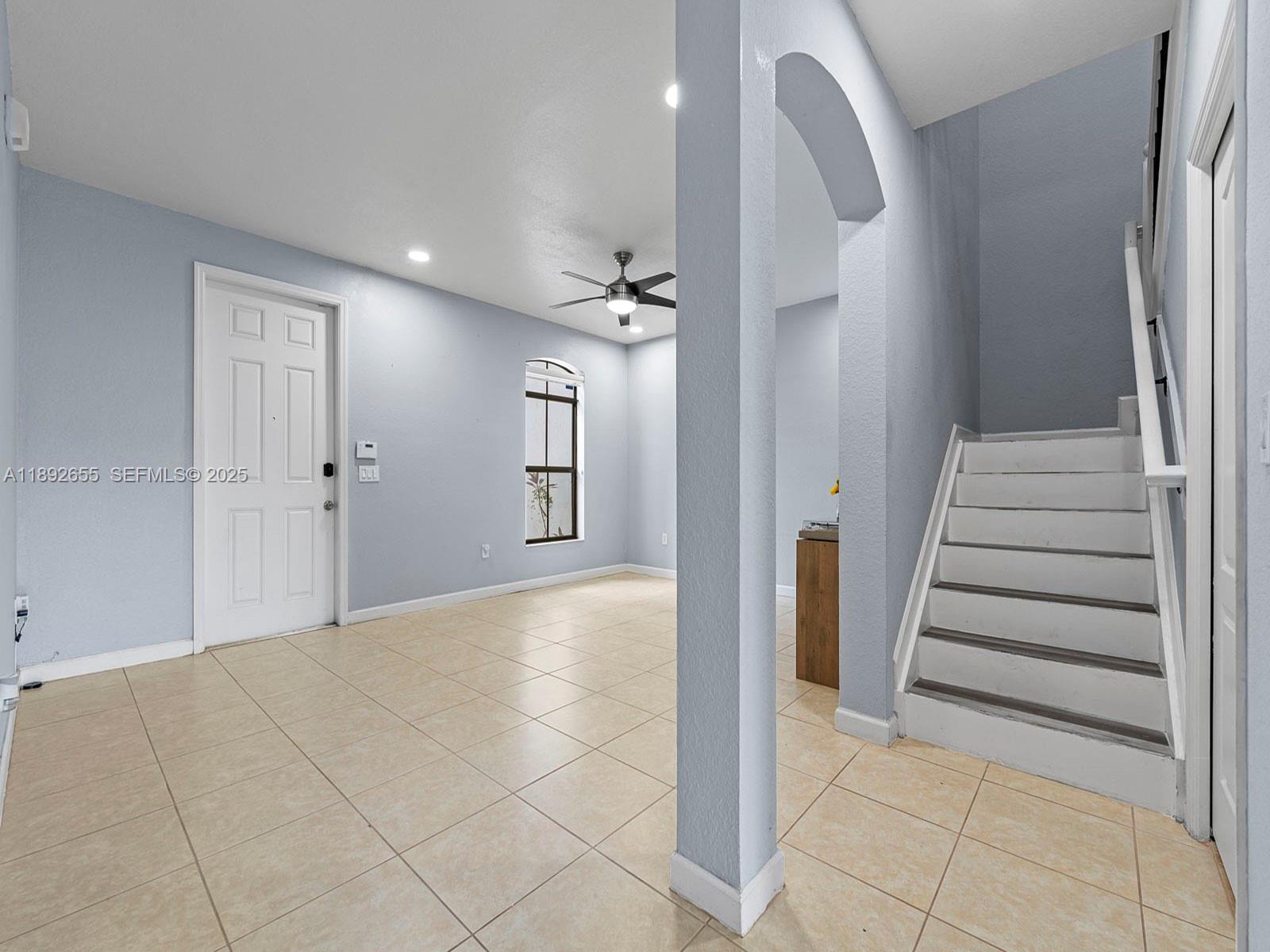 11279 Southwest 238th Street Homestead, FL 33032 - Photo 2 of 40 a view of a hallway with entryway and stairs
